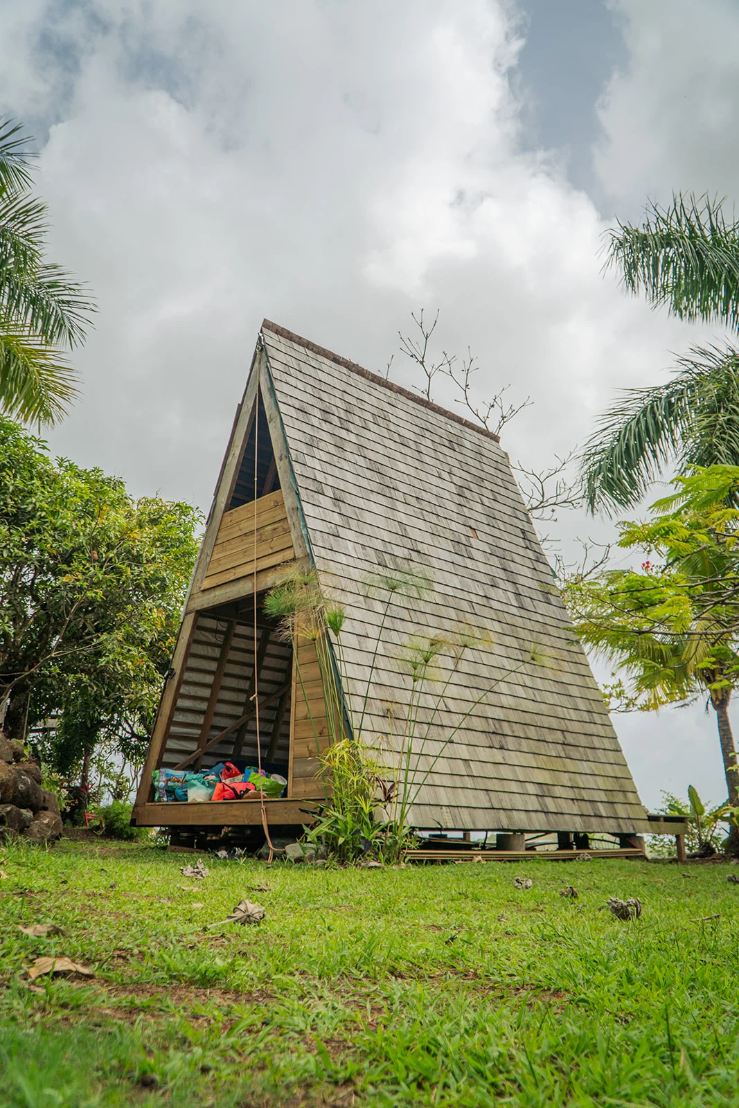 The A-frame in Wapa shingles, palms and open sky